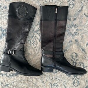 Black leather Vince Camuto boots.